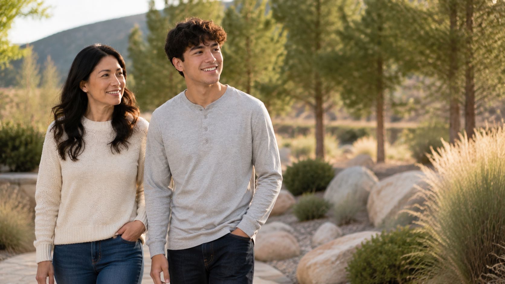 Couple walking happily through a sunny park